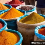 Home 21 향신료 블렌드의 생산과 유통 과정 - A vibrant market scene in a Spanish town showcasing local spice vendors with colorful sacks of spice...